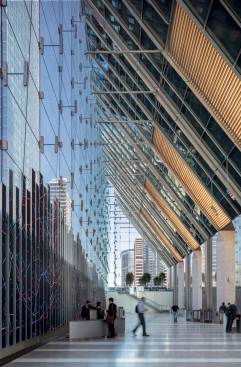 Lobby Looking North - Tenants and visitors enter through a dramatic, 90-foot-high lobby enclosed by a glass-fin wall hung from the structure above.