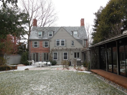 The "before" exterior of our Observatory Hill project combined the classic Colonial brick façade with a more midcentury styled indoor pool. The transition between the two structures lacked cohesion and connectedness. 