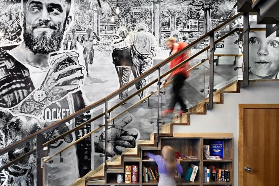 Customers come face to face with Downtown Spokane imagery as the mural flows up the stairs to the skywalk level.