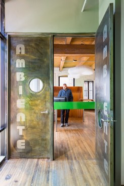 Looking through metal front doors into chiropractor's office front desk