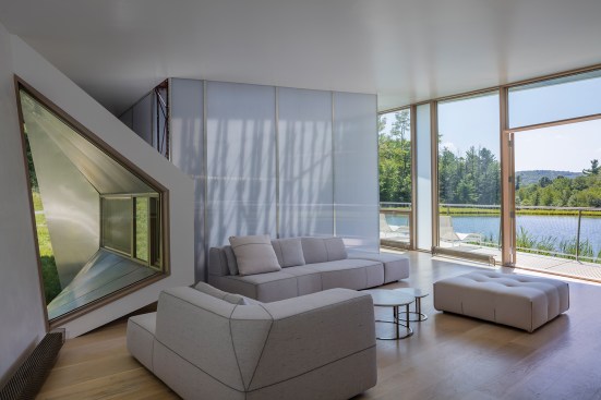 The seating area off the kitchen is furnished with pieces from B&B Italia.