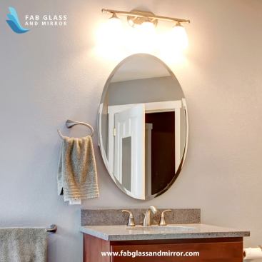 wall mirror installed on bathroom wall