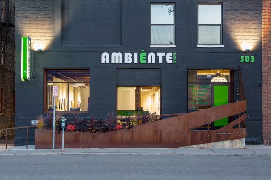 Exterior of Ambiente building with interior lights on