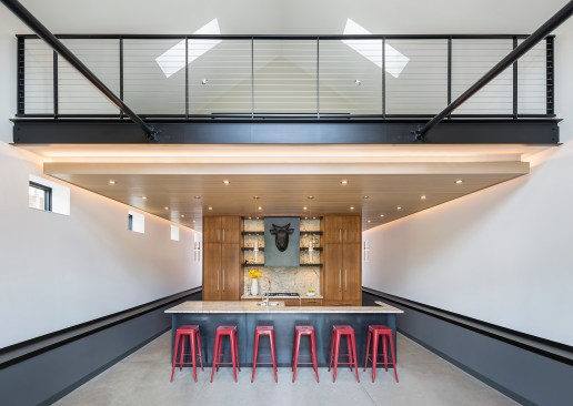 Kitchen and loft directly above in older building that has been converted to event space