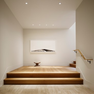 A 9.5-foot-wide foyer sees the start of the wide oak staircase that serves as the main circulation route through the house.