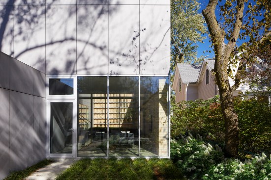 The rear, alley-facing elevation is clad in recycled portland cement plaster with an integral finish.