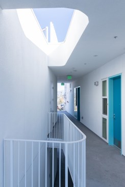 Open hallways receive natural daylight through light wells. 
