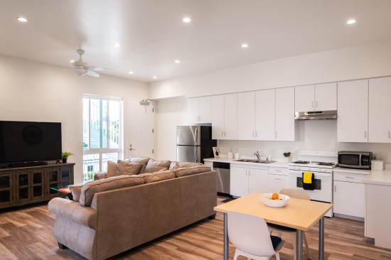 The white-painted studio to three-bedroom units feature Frigidaire appliances and Cali Bamboo floors.