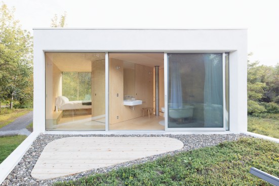 The second story contains a master suite and roof deck.