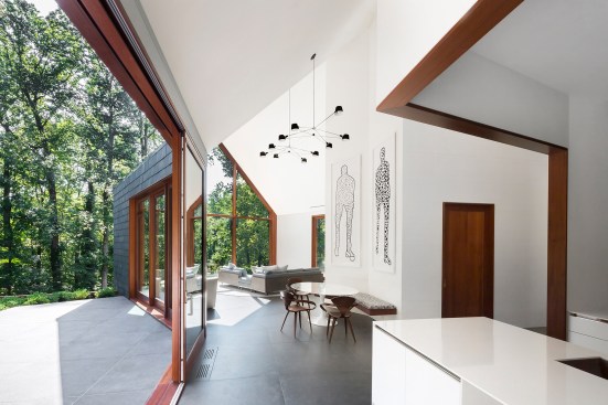 Duratherm doors open to exterior spaces throughout the house, such as the north poolside terrace off the family room and kitchen.