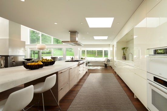 Remodel of Edina Mn residence, PK architects, Streeter and Associates, Andrew Flesher Interiors, ©Karen Melvin Photography, modern, contemporary, white, white kitchen, pizza oven, fireplace modern, monochromatic, woods, woodfloor, modern lamps, feather chandelier, feather pendant, poolside, Womb Chair, wire chair, remodel, remodel modern, architecture minnesota, AM cover