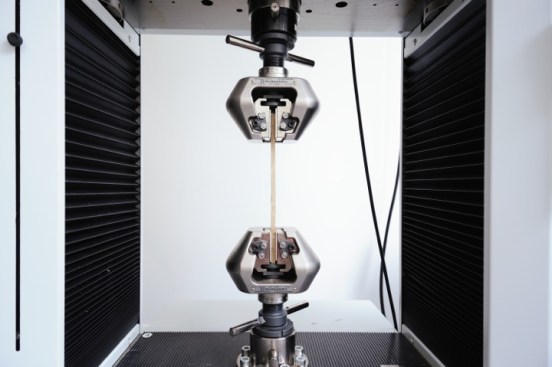 Testing the strength of bamboo-reinforced concrete.