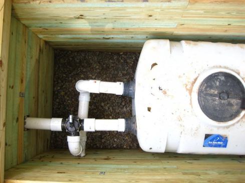 Overflow rainwater is sent to a 200-gallon cistern where it can be hand-pumped for use on the garden.
