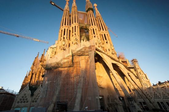 A roadside glimpse of the interminable construction of La Sagrada Familia.