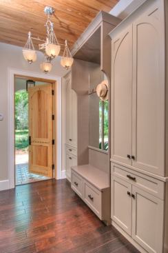 Wynne and his crew reclaimed the pecky cypress front door from the original house on the property, a bungalow built in the early 1950’s. 91 to 92 percent of the waste from demolition was recycled or reused in the new house, and a local woodworker made the cabinetry. “The client had a real commitment to using local and recycled materials,” Wynne says.