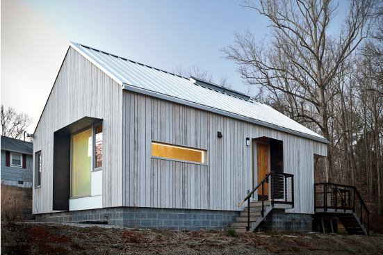 The tiny home's scale, form, and natural features echo those of the original Norris, Tenn., cottages built in 1933.