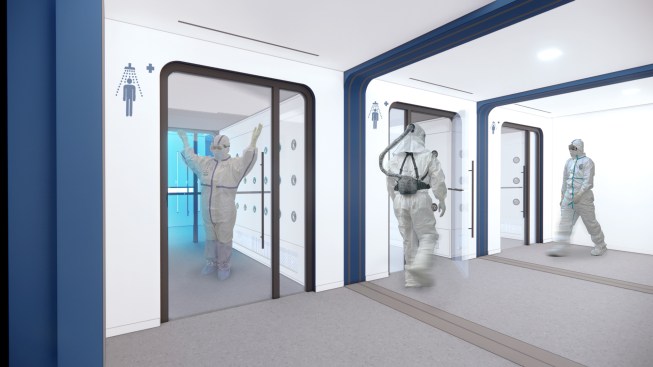 The support buildings house a variety of functions, such as a decontamination area on the first floor, IT and server hub on the second floor, and a security center on the third.