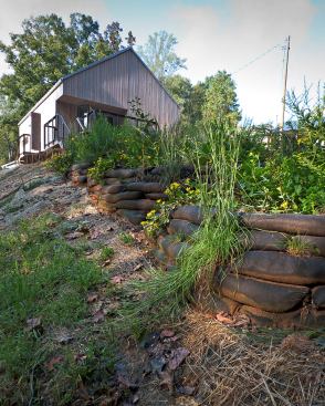 A steep slope is addressed with five terraced bioretention beds that treat graywater and rainwater.