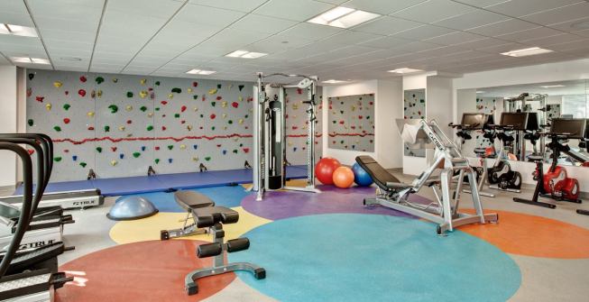 The building, which has been designed to meet the NYC Active Design Guidelines to promote physical fitness and reduce obesity, includes a fully equipped gym.
