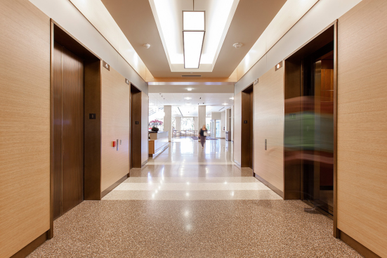 Elevator transoms in ViviChrome Chromis glass with Taupe interlayer and Opalex finish; custom elevator door skins at Lloyd Center Tower, Portland, Oregon