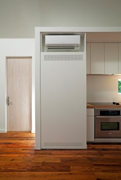 A Mitubishi mini-split unit helps keep the house cool on sweltering summer days.