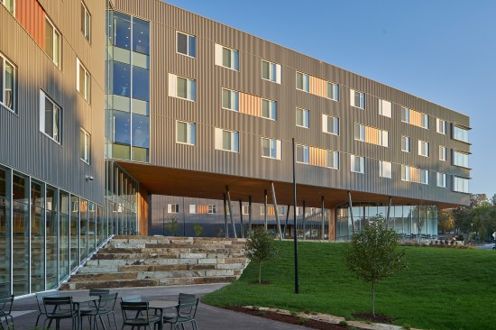 Corrugated metal paneling clads the student residence.