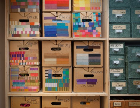 Samples from Girard’s archive, maintained by the Vitra Design Museum, stored in boxes that he arranged and labeled by color.