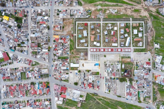 Aerial view of the Apan Housing Laboratory, which was master planned by MOS. The welcome and education center designed by MOS is at the base of the site, adjacent to 32 affordable house prototypes, each designed by a different firm.