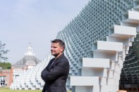 Bjarke Ingels stands in front of the Serpentine Gallery and the 2016 Serpentine Gallery Pavilion he and his firm, BIG, designed.