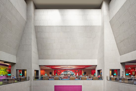 The existing atrium was one of the most challenging spaces to relight because the three-story space was so tall and there was no way to conceal fixtures.