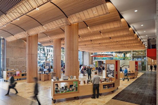 Boylston Hall, the library’s new two-story multifunctional space, opens the building to the street and features a wooden vaulted ceiling, mobile carts, and welcoming general light.