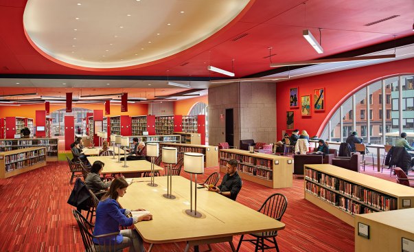 Suspended T5HO 3500K linear direct fixtures and downlights provide general illumination for the reading areas.