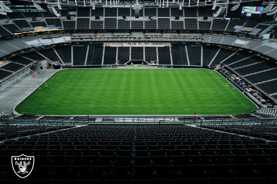 Construction workers roll the field tray into Allegiant Stadium, home of the Las Vegas Raiders, Wednesday, July 15, 2020, in Las Vegas, Nev.
