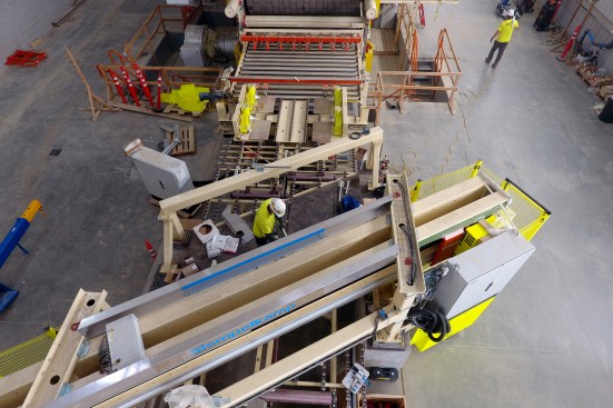 View of the flying cut-off saws for MDF panels