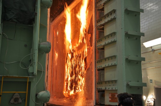The exposed surface of a three-ply cross-laminated timber floor that was initially protected with two layers of 13-millimeter Type X gypsum board. The test was terminated after 96 minutes.