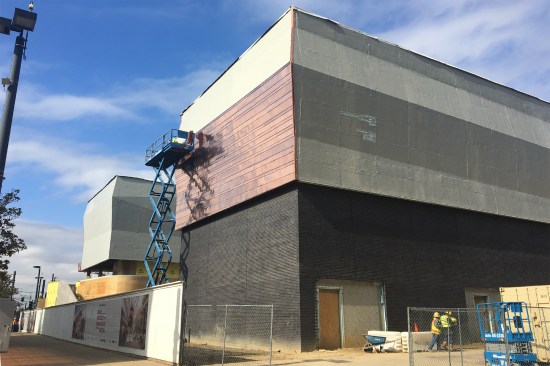 Workers attached the unitized subframing panels to the building's steel structure, covered the plywood sheathing with a liquid air-and-water barrier, and then hung 3,500 copper panel sheets.