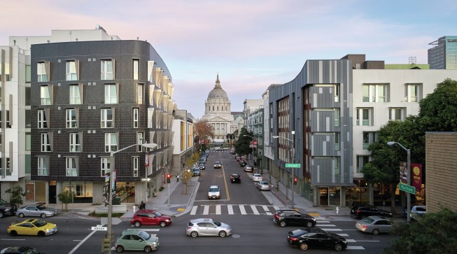 This city view is framed by the complementary curves of 388 Fulton and Richardson Apartments. 388 Fulton (left) was the first market-rate micro-housing in San Francisco -- 69 compact, refined homes over neighborhood retail. Richardson Apartments (right) -- affordable, supportive studio housing -- is a haven for formerly unhoused residents and an asset for the neighborhood, which suffered a fracture following the demolition of an urban freeway.