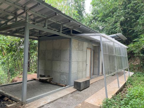 Front elevation of the 387-square-foot home built with concrete and mortar containing eight percent diaper shreddings