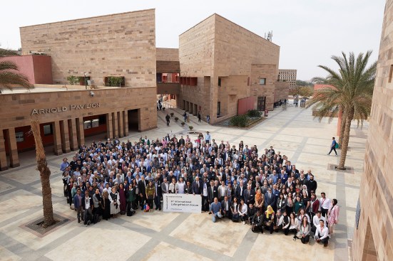 Attendees and presenters gather on the AUC campus