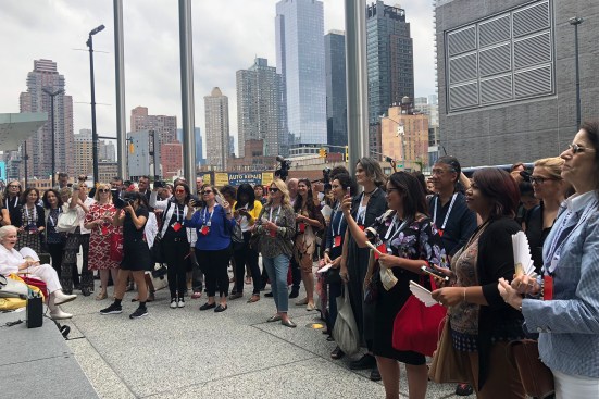 A group assembles as the organizers read the Voice of Women Architects manifesto.