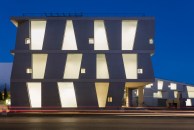 Night view of the Glassell School of Art by Steven Holl Architects, west elevation.