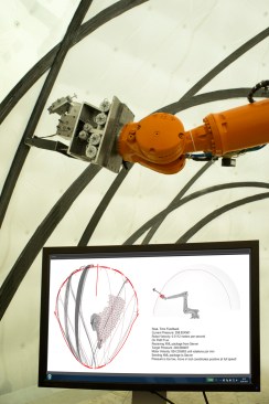 An on-site sensor interface manages the adaptive fiber placement.