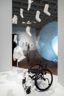 Installation view, including "Seated Design: Sleeves and Shirt" by Lucy Jones and the TiLite Wheelchair for FFORA Attachment System by Numotion