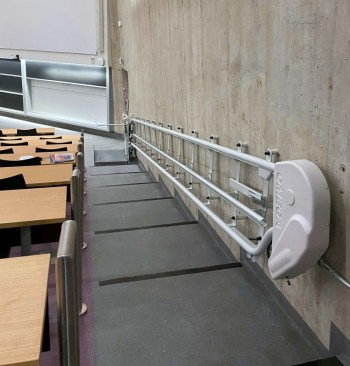 Posing an unusual challenge during measuring and installation: the interior walls of the lecture halls slope inward increasingly as the stairs rise.