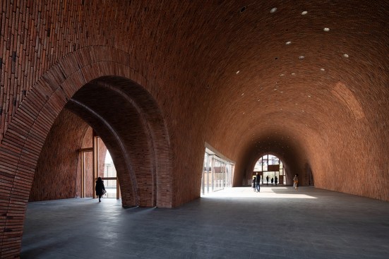 Traditional smoke holes used in ancient kiln design are adapted to bring in natural light or to hide artificial light sources.