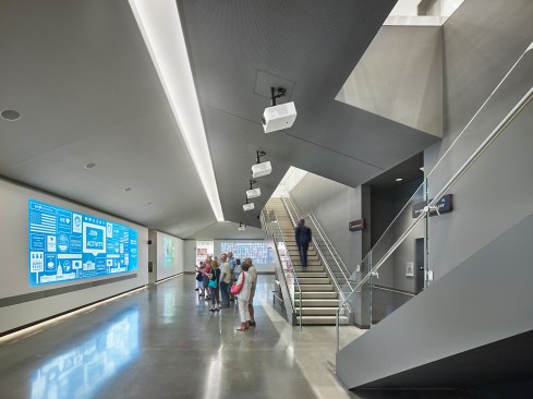 The exhibits are digital and projected onto the surrounding walls.