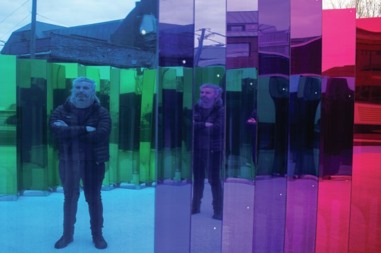 SoftLab founder Michael Szivos's reflection in one of the interior mirrors of his "Mirror Mirror" installation in Alexandria, Va.