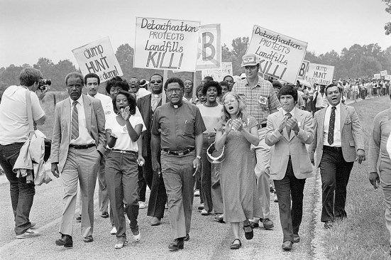 Protesters marching against a PCB landfill in Afton, Warren County, North Carolina, led by Reverend Leon White (second from left), Reverend Joseph Lowery (center), and Ken Ferruccio (second from right). 1982. Getty Images, Bettmann Archive.