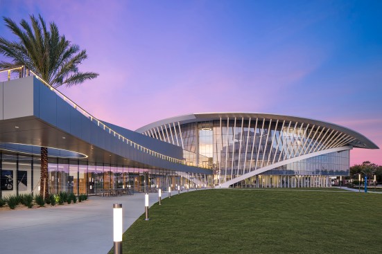 Pathway and handrail lighting along the roof terrace reinforce the building’s avian-inspired form.