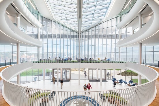 Lighting reinforces the orbital-like space of the student commons.
